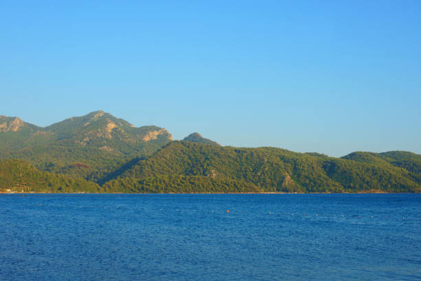 istock seascape, mountains, rocks, sky and water 1163564562