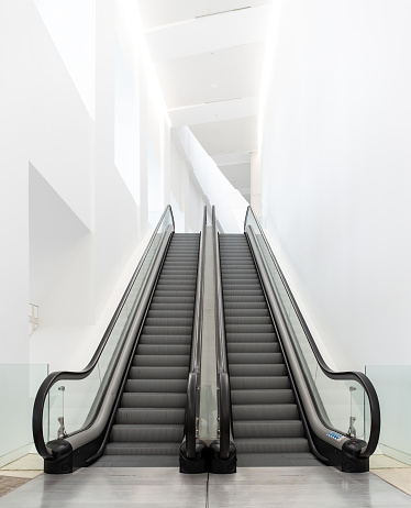 Modern luxury escalator on indoor building. No people