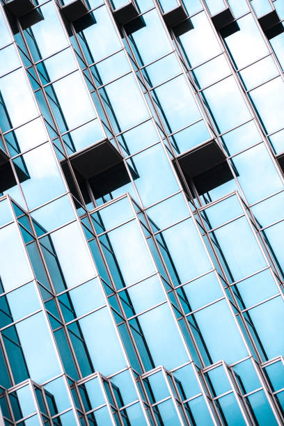 istock underside panoramic and perspective view to steel blue glass high rise building skyscrapers, business concept of successful industrial architecture 1163568121