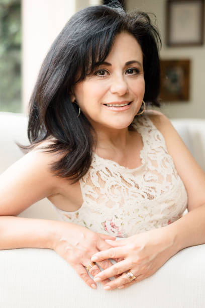 istock Smiling mature woman posing and looking at camera 1163568179