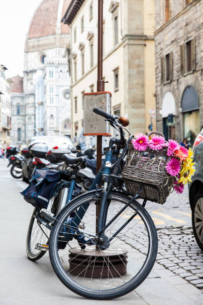 istock Bicycle decorated with flowers parked at Via de Cerretani in Florence 1163568741