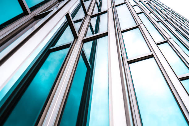 istock underside panoramic and perspective view to steel blue glass high rise building skyscrapers, business concept of successful industrial architecture 1163569785