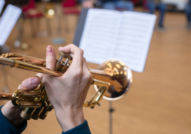 istock trumpet playing at a school rehearsal 1163571218