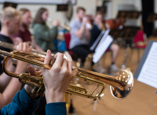 istock trumpet playing at a school rehearsal 1163571261