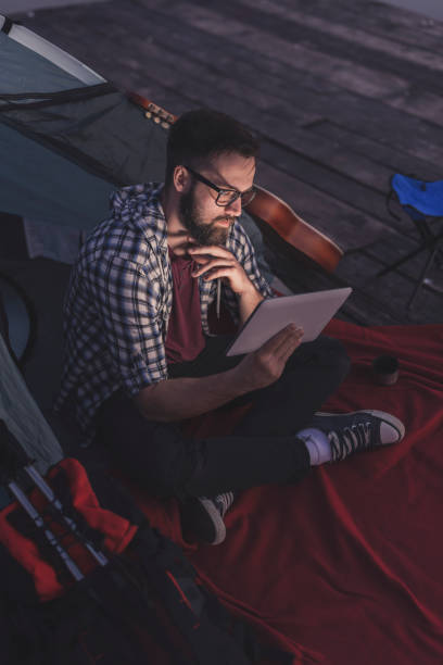 istock Digital nomad camping by the lake 1163571662