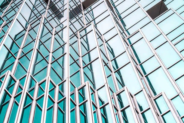 istock underside panoramic and perspective view to steel blue glass high rise building skyscrapers, business concept of successful industrial architecture 1163571676