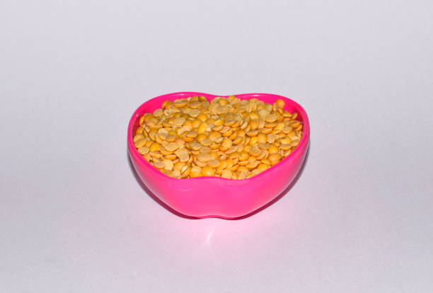 Pigeon pea or arhar or toor pulse isolated in white background