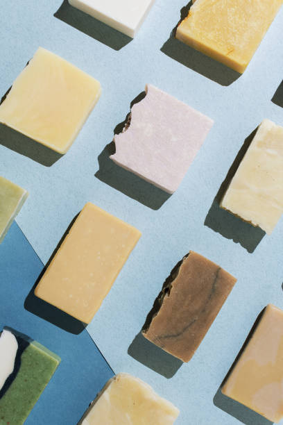 istock Flatlay of various natural hand-made soaps on blue 1163574827