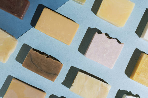 istock Flatlay of various natural hand-made soaps on blue 1163574834