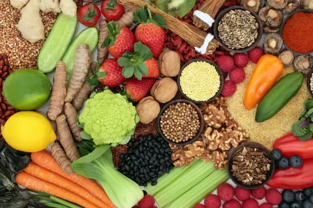 Liver detox diet health food concept with fresh fruit, vegetables, herbs, spices, legumes, herbal medicine, nuts, grains &  seeds. Foods high in antioxidants, anthocaynins, vitamins &  dietary fibre. Top view.