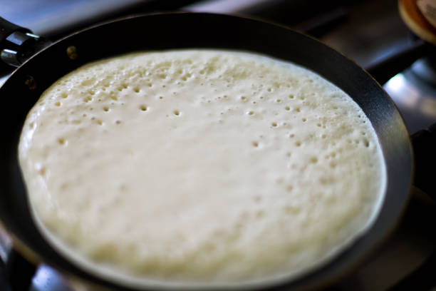 istock Macro close-up of pancake cooking in a pan 1163576063