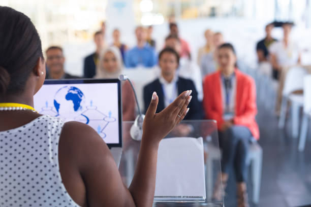 istock Female speaker speaks in a business seminar 1163576146