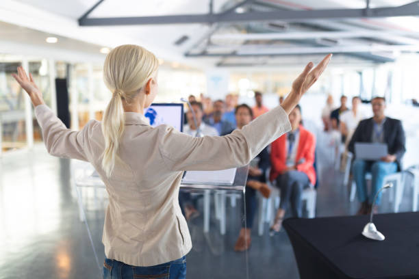 istock Female speaker speaks in a business seminar 1163576170