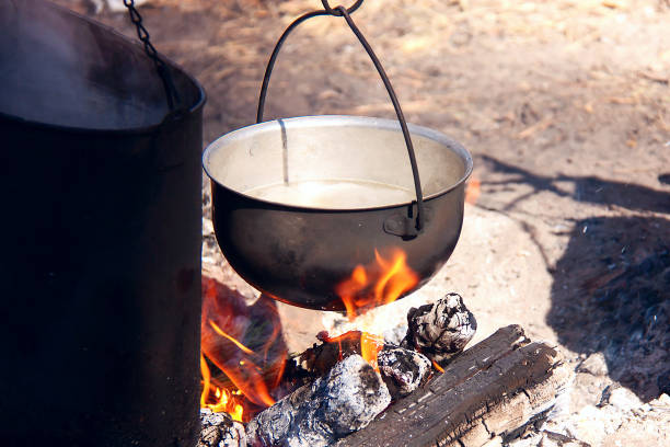 istock Cooking in a camping trip, outdoor kitchen. 1163576416