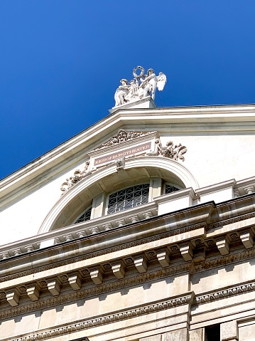 Vienna, Austria - July, 20 - 2019: Hofburg Theater, statues on top, rear side.