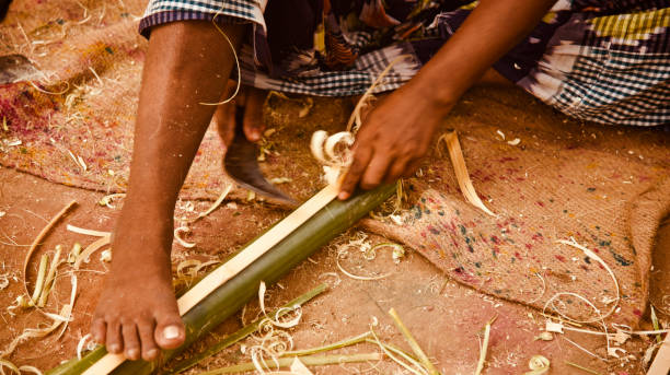 istock Man working with bamboo sticks unique photo 1163579154