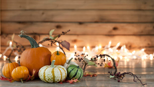 istock Autumn pumpkin arrangement on a wood background 1163579213