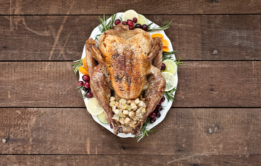 Thanksgiving Roasted Turkey on an old Wood Table