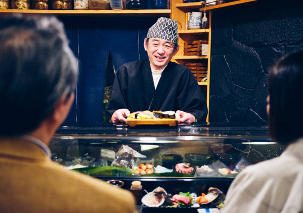 istock Japanese Sushi Chef in a Sushi Shop 1163580732