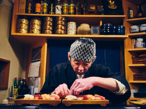 istock Japanese Sushi Chef in a Sushi Shop 1163580809