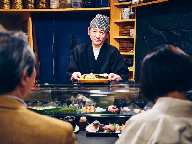 istock Japanese Sushi Chef in a Sushi Shop 1163580877