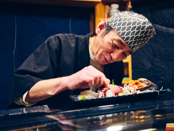 istock Japanese Sushi Chef in a Sushi Shop 1163580879