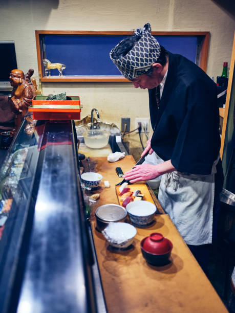 istock Japanese Sushi Chef in a Sushi Shop 1163580931
