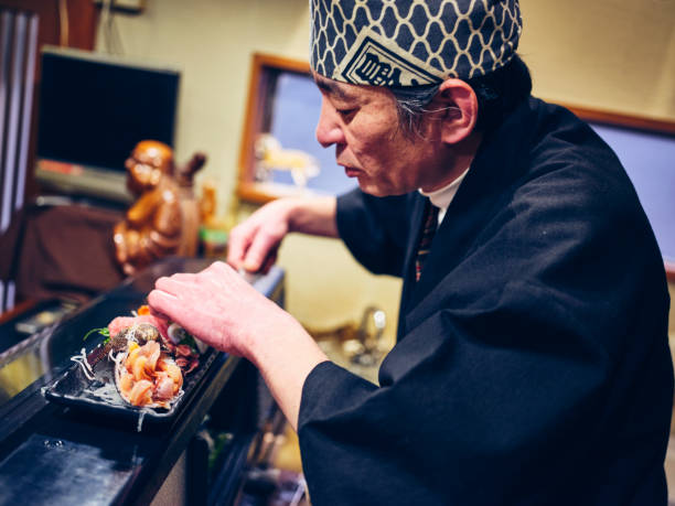 istock Japanese Sushi Chef in a Sushi Shop 1163581029