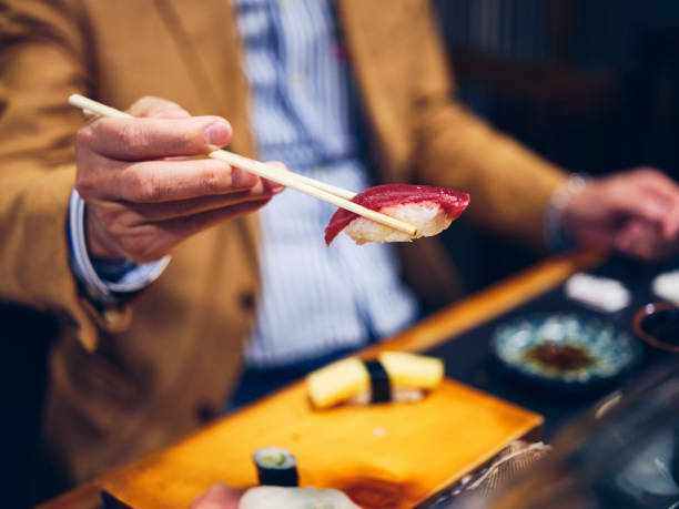 istock Japanese Sushi Chef in a Sushi Shop 1163581078