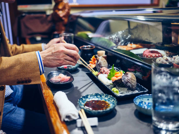 istock Japanese Sushi Chef in a Sushi Shop 1163581167