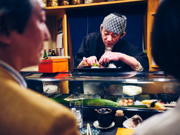 istock Japanese Sushi Chef in a Sushi Shop 1163581267