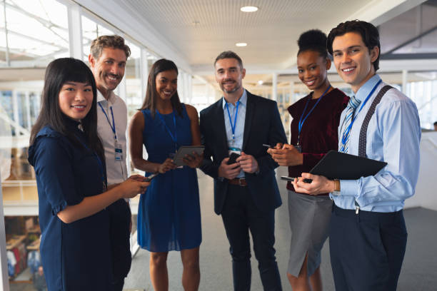 istock Business people discussing over digital tablet in a modern office 1163581905