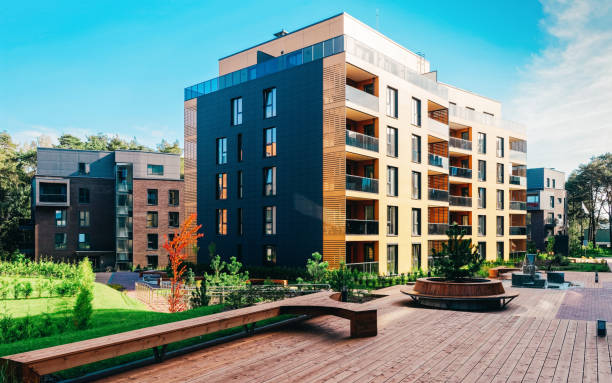 istock EU Pine tree at architectural complex of apartment building 1163583217