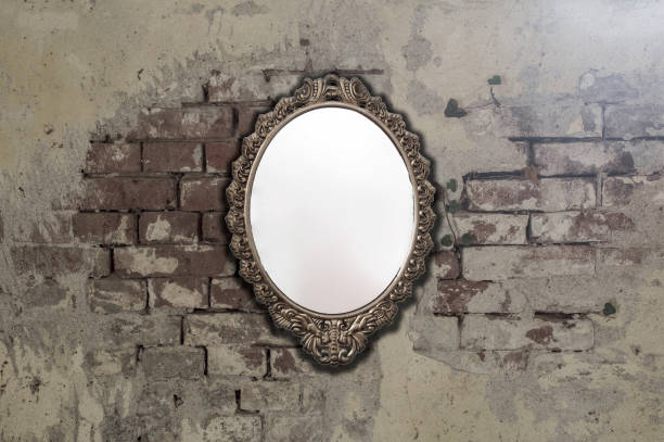 istock Vintage antique mirror on old brick wall background texture 1163584309