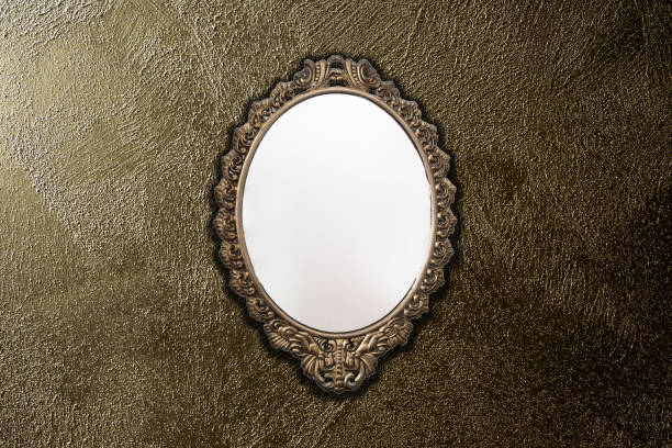 istock antique mirror on gold wall background texture, vintage design 1163584674