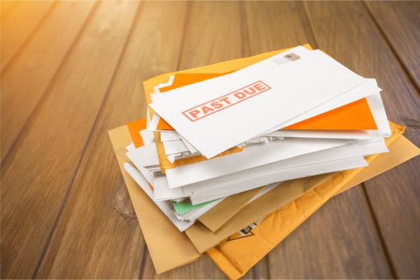 Mail. Pile of envelopes with overdue utility bills isolated on white debt stock pictures, royalty-free photos & images