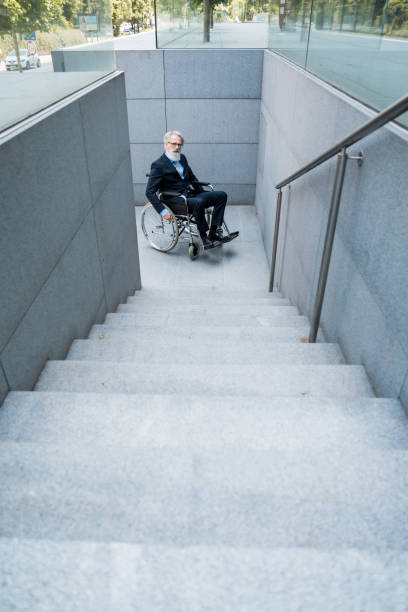 istock Senior businessman on wheelchair 1163587888