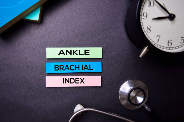 istock Ankle Brachial Index text on Sticky Notes. Top view isolated on black background. Healthcare/Medical concept 1163588307
