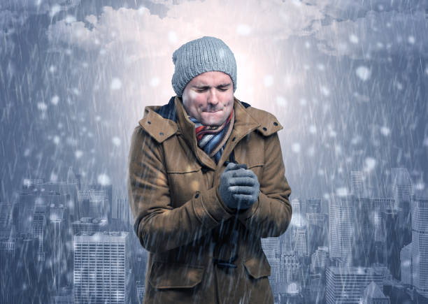 istock Boy freezing in cold weather with city concept 1163588398