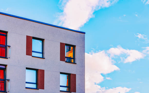 istock EU Part modern apartment house copy space blue sky clouds 1163593289