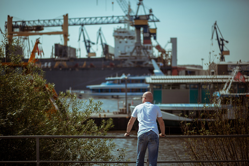 Tourist looks around in the port of Hamburg