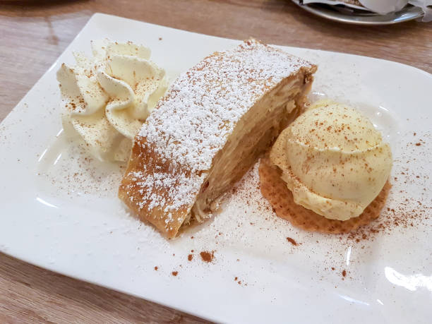 istock Apple pie with cream and vanilla ice cream 1163594492