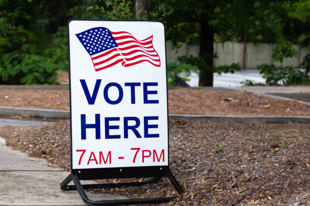 istock Vote here sign outside an election site. 1163595340