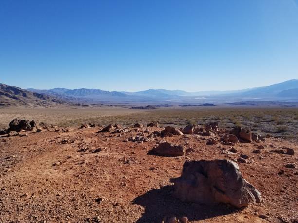 istock Death Valley Entrance with shadowed rocks and distant mountains 1163597851