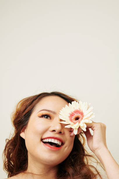 istock Asian woman with gerbera 1163597878