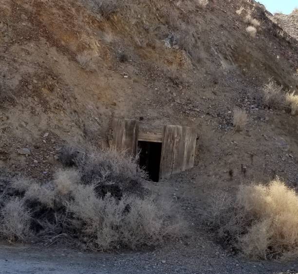 istock Abandoned Mine Shaft entrance cave 1163599384