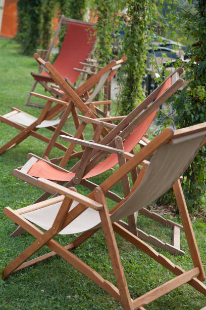 istock Many wooden foldable garden chairs 1163600840