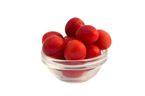 Group of red wild cherry plums isolated on the white background.