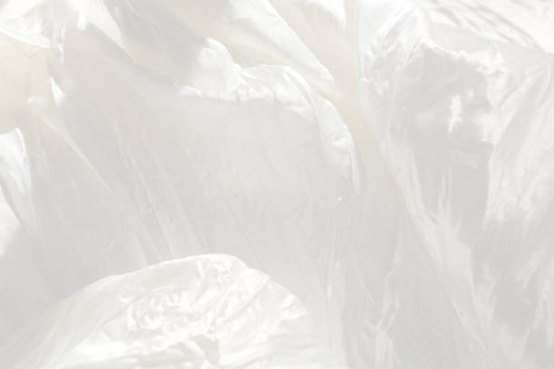 istock Very gentle delicate beautiful elegant light white blur background - natural matte and shiny silk in drapery, folds, wrinkles for wedding cards, exquisite solemn backgrounds 1163602602