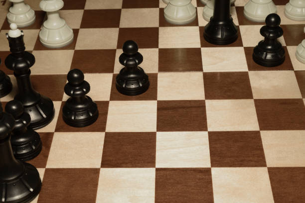 istock Wooden chessboard with black chessmen as a hobby concept 1163602809
